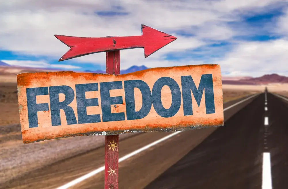 Freedom sign with road background Freedom sign with road background